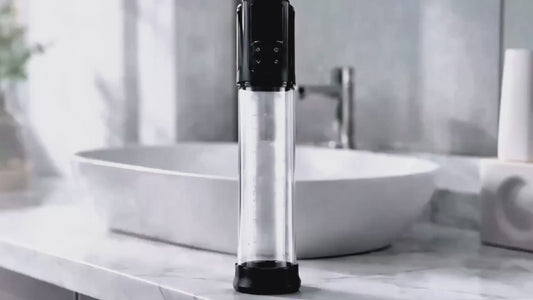 Erojoy Vacumate Automatic penis pump standing on a bathroom counter
